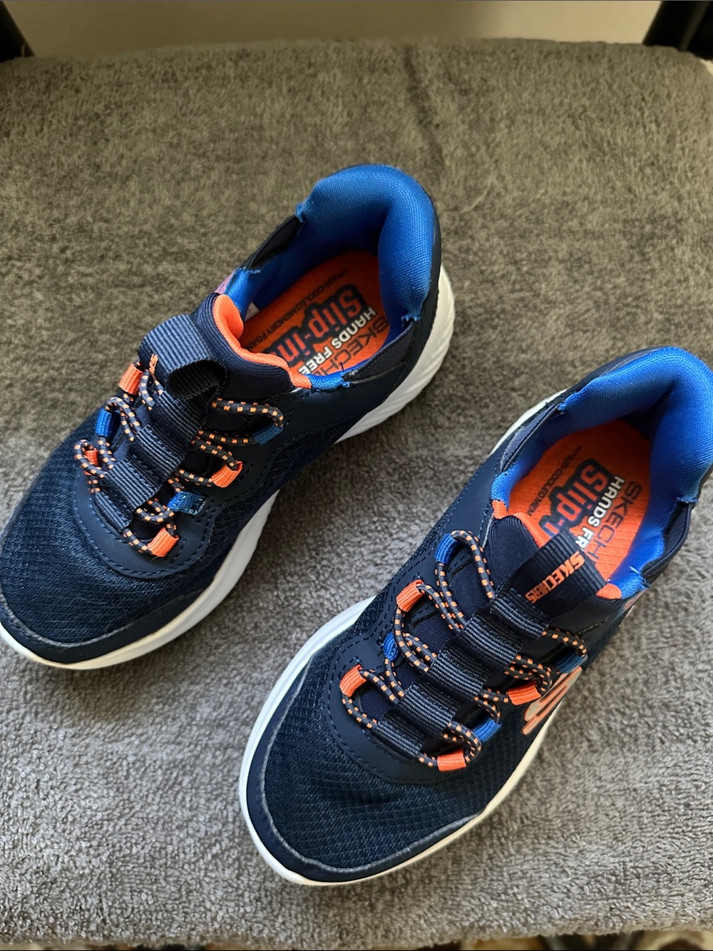 Skechers Kids Navy Blue and Orange Slip-On Sneakers